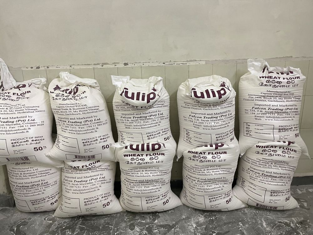 Tulip wheat flour sacks whose label reads Manufactured by Capiem Global Pvt Ltd, with text in Sinhala, Tamil and English