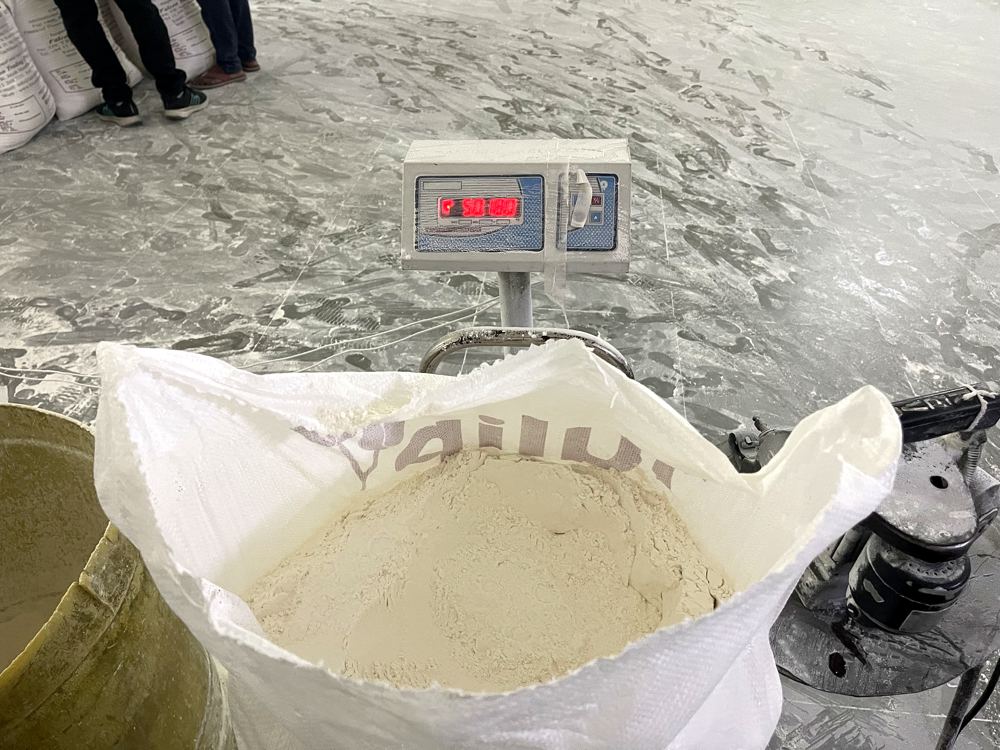 A filled wheat flour sack sitting on the mill scale