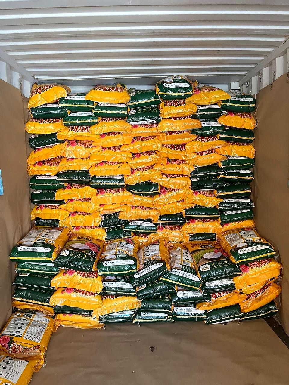 An export container stacked to the roof with Capiem rice sacks