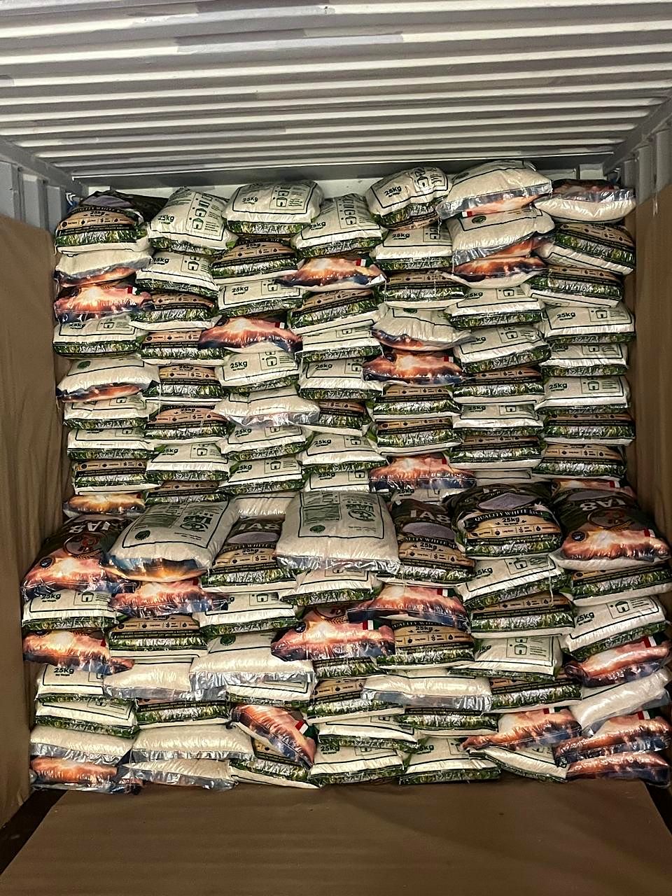 A container packed with 25 kg rice sacks from floor to roof